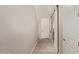 Clean hallway with modern doors, light wood-look floors and light paint at 8026 S 6Th Dr, Phoenix, AZ 85041