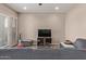 Cozy living room with modern furniture, a ceiling fan and ample natural light, perfect for relaxing at 8026 S 6Th Dr, Phoenix, AZ 85041