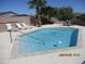 Private backyard featuring a swimming pool, lounge chairs, and a patio at 8026 S 6Th Dr, Phoenix, AZ 85041