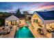 Stunning aerial view of the backyard oasis with a pool, outdoor kitchen, and manicured landscaping at 8220 E Sharon Dr, Scottsdale, AZ 85260