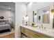 Bright bathroom with double vanity, modern fixtures, and access to the main bedroom at 8220 E Sharon Dr, Scottsdale, AZ 85260