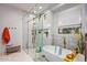 Bright bathroom featuring a freestanding tub, frameless shower, and elegant fixtures at 8220 E Sharon Dr, Scottsdale, AZ 85260