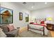 Cozy bedroom features a decorative bedframe, bright windows and a sitting area at 8220 E Sharon Dr, Scottsdale, AZ 85260
