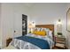 Comfortable bedroom featuring stylish decor, lighting, and built in washer and dryer at 8220 E Sharon Dr, Scottsdale, AZ 85260