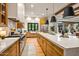 Gourmet kitchen with stainless steel appliances, large island, and access to the backyard at 8220 E Sharon Dr, Scottsdale, AZ 85260
