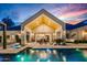 Beautiful backyard with a pool, covered patio, and ample space for outdoor entertaining at 8220 E Sharon Dr, Scottsdale, AZ 85260