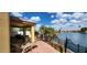 Back patio area with patio table and lounge chair overlooking waterfront views at 8935 W Acoma Dr, Peoria, AZ 85381