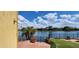 Lakeside backyard featuring a lush lawn, palm trees, and community views at 8935 W Acoma Dr, Peoria, AZ 85381