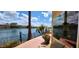 Patio and lake view with desert landscaping and lounge chairs at 8935 W Acoma Dr, Peoria, AZ 85381