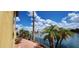 Palm tree lined waterfront property and backyard at 8935 W Acoma Dr, Peoria, AZ 85381