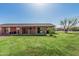The backyard has a green lawn, privacy and access to a covered patio at 9816 N 95Th Dr # A, Peoria, AZ 85345