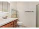 A simple bathroom featuring white walls, tile floors and a wood vanity at 9816 N 95Th Dr # A, Peoria, AZ 85345