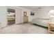 This bedroom features white walls, carpet and a sliding glass door to the back patio at 9816 N 95Th Dr # A, Peoria, AZ 85345