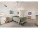 This bedroom features white walls, carpet and matching wooden dressers at 9816 N 95Th Dr # A, Peoria, AZ 85345