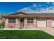 Charming single-story brick home with a well-manicured lawn and attached garage, offering comfortable living at 9816 N 95Th Dr # A, Peoria, AZ 85345