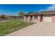 Charming one-story brick home on a green lawn, featuring a covered entry and attached garage at 9816 N 95Th Dr # A, Peoria, AZ 85345