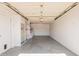 Spacious garage featuring painted walls, built-in shelving, and a washer and dryer at 9816 N 95Th Dr # A, Peoria, AZ 85345