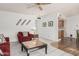 Comfortable living room featuring neutral decor and an open floor plan leading to kitchen at 9816 N 95Th Dr # A, Peoria, AZ 85345