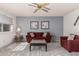 Inviting living room with neutral walls, plush carpet, and comfortable seating arrangement at 9816 N 95Th Dr # A, Peoria, AZ 85345