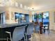 Modern bar with stone countertop and adjacent dining area with stylish decor at 10113 E Topaz Dr, Scottsdale, AZ 85258