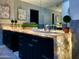 Modern bathroom featuring a double vanity with illuminated countertop, sleek cabinets, and stylish decor at 10113 E Topaz Dr, Scottsdale, AZ 85258