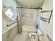 Bright bathroom features tub, shower, decorative window, and marble tile at 10113 E Topaz Dr, Scottsdale, AZ 85258