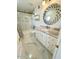 Bathroom featuring a tub, shower, decorative mirror, and vanity with stone countertop at 10113 E Topaz Dr, Scottsdale, AZ 85258