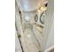 Long bathroom features decorative mirrors, tub-shower combo, marble floors, and stone countertops at 10113 E Topaz Dr, Scottsdale, AZ 85258