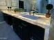 Modern bathroom featuring a double vanity with illuminated countertop, sleek cabinets, and luxurious finishes at 10113 E Topaz Dr, Scottsdale, AZ 85258