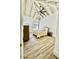 Bedroom features wood flooring, a ceiling fan, neutral walls, and a decorative window at 10113 E Topaz Dr, Scottsdale, AZ 85258