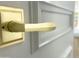 Close-up of gold door hardware showcasing its elegant design and premium finish, adding to home's interior charm at 10113 E Topaz Dr, Scottsdale, AZ 85258