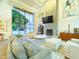 Inviting living room showcases fireplace, modern chandelier, and a comfortable, spacious layout at 10113 E Topaz Dr, Scottsdale, AZ 85258