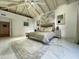 Bright main bedroom featuring a vaulted ceiling, modern decor, a large bed, marble floors, and an inviting aesthetic at 10113 E Topaz Dr, Scottsdale, AZ 85258