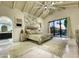 Spacious main bedroom with vaulted ceiling, modern decor, a view to a balcony, and a luxurious en-suite bath at 10113 E Topaz Dr, Scottsdale, AZ 85258