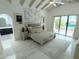 Bright main bedroom featuring vaulted ceilings, neutral tones, and a seamless bathroom access at 10113 E Topaz Dr, Scottsdale, AZ 85258