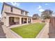 Beautiful backyard featuring well-maintained synthetic grass, perfect for outdoor entertaining and relaxation at 10425 E Corbin Ave, Mesa, AZ 85212