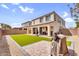 View of backyard with synthetic grass, patio, and stucco wall providing a private outdoor space at 10425 E Corbin Ave, Mesa, AZ 85212