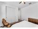 Well-lit bedroom featuring ample closet space and a classic wooden dresser at 10425 E Corbin Ave, Mesa, AZ 85212