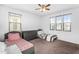 Bright bedroom showcasing two beds, a dresser, and natural light at 10425 E Corbin Ave, Mesa, AZ 85212