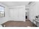 Bedroom with a closet, window, and entrance to the bathroom at 10425 E Corbin Ave, Mesa, AZ 85212