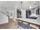 Spacious kitchen with a large island, stainless steel appliances, and barstool seating for casual dining at 10425 E Corbin Ave, Mesa, AZ 85212