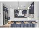Modern kitchen boasts stainless steel appliances, a center island with breakfast bar, and ample counter space at 10425 E Corbin Ave, Mesa, AZ 85212