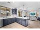 Open-concept living room with access to a backyard patio with an adjoining kitchen at 10425 E Corbin Ave, Mesa, AZ 85212