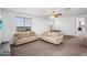 Expansive living room featuring multiple sofas and ample natural light at 10425 E Corbin Ave, Mesa, AZ 85212