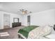 Spacious main bedroom with carpet, ceiling fan, and ensuite bathroom at 10425 E Corbin Ave, Mesa, AZ 85212