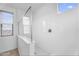 Bright shower with glass doors, white tile, and sleek fixtures at 10425 E Corbin Ave, Mesa, AZ 85212