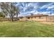 Spacious backyard with lush green grass and mature tree, perfect for outdoor activities at 1059 E 9Th Ave, Mesa, AZ 85204