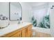 Bright bathroom featuring a vanity, toilet, and shower with a decorative green leaf curtain at 1059 E 9Th Ave, Mesa, AZ 85204