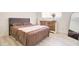 Cozy bedroom featuring a comfortable queen-sized bed, dresser, and a full-length mirror, perfect for relaxation at 1059 E 9Th Ave, Mesa, AZ 85204