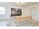 Bright dining area with sleek floors, seamlessly connecting to the living space and offering backyard views at 1059 E 9Th Ave, Mesa, AZ 85204